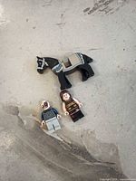 Front view showing black printed horse and two minifigures