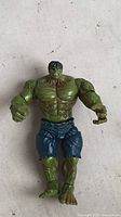 Front view of Hulk action figure showing overall condition, articulation points and missing paint areas