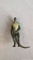 Front view of loose 2011 Marvel The Lizard action figure with attached tail