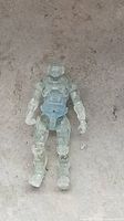 Front view of translucent Master Chief action figure lying flat