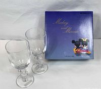 Pair of wine glasses next to original box