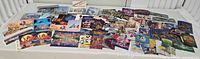Wide view of entire spread of Disney postcards on table