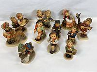 Group shot of all eleven figurines showing size and variety
