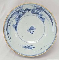 Interior view showing full underglaze blue decoration and gilt rim