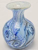 Full view of vase front showing swirled blue white pattern and shape