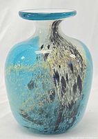 Front view of Mdina Glass turquoise and blue art glass vase