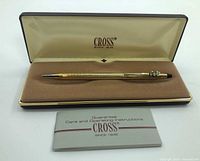 Pen, case interior and booklet visible