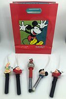 All five character wands and Mickey gift bag