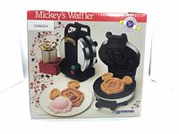 Front of retail box showing product image and Mickey Mouse waffle