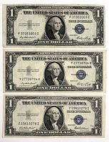 Obverse of all three $1 silver certificates showing blue seals and serial numbers