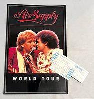 Front cover of program with two ticket stubs