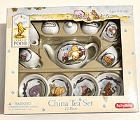 Front view of boxed 12-piece Classic Pooh china tea set