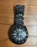 Front view showing dial, bezel, bracelet