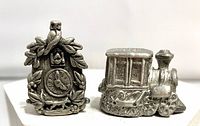 Front view of cuckoo clock and train pewter thimbles