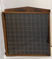 Front view of wooden display case with acrylic cover closed