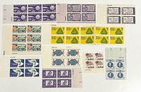 Front view of all eleven plate blocks showing designs and plate numbers