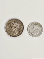 Front view of both coins showing obverse designs