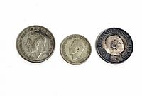 Obverse sides of three coins showing portraits