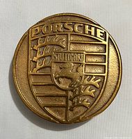 Front view showing Porsche crest design