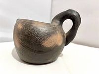 Side view showing overall swan form and fire-cloud coloration