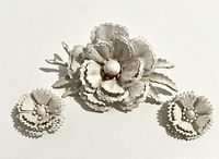 front view of brooch and earrings