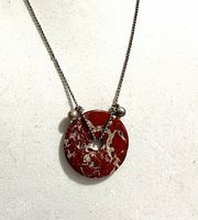 Full view of necklace showing pendant, chain and bead details