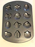 Full view of Wilton 12-cavity pan showing all themed molds.