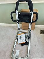 Full view of assembled bed safety rail, strap, manual, hardware and box