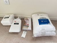 Five sealed bedding packages laid out