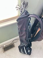 Full view of Ping carry bag with clubs inside