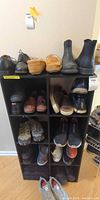 Entire shelving unit with multiple pairs of men’s shoes