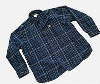 Full view of the Carhartt flannel shirt laid flat