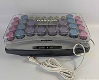 Full view of Babyliss heated roller unit with lid and cord