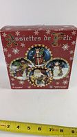 Front of box showing Assiettes de Fête and plate designs