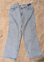 Full view of front side of jeans laid flat