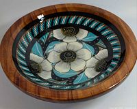 top view showing floral artwork and wood grain rim