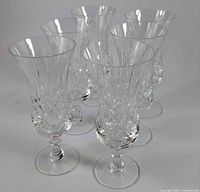Six Imperial Crystal Clara champagne flutes grouped