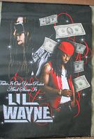 Front view of poster showing Lil Wayne images, slogan, and graphics