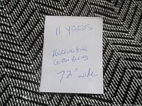 Close-up of herringbone cotton blend fabric with note showing 11 yards, 72 in wide