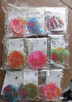Multiple sealed pairs of Monster Trendz floral disc earrings