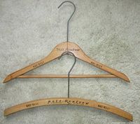 Both wooden hangers front view showing styles and printed branding
