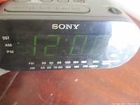 Front view showing Sony branding, digital display, frequency scale