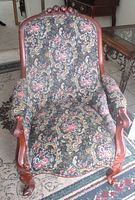 Full front view of Victorian mahogany armchair showing overall design and upholstery