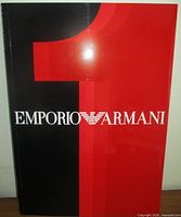 Front cover showing red/black design, large 1 and Emporio Armani logo