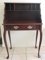 Full view of secretary desk showing hutch, drawer, legs