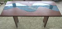 Top view of table showing wood surface and blue resin river inlay