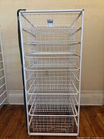 Front view of white Elfa storage drawer tower with six wire drawers