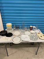 Full view of assorted dishes and glasses arranged on table