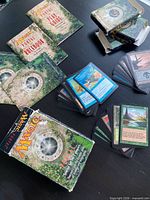 Cards, rulebooks, play guide and box spread on table