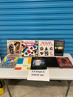 All nine books laid out on table